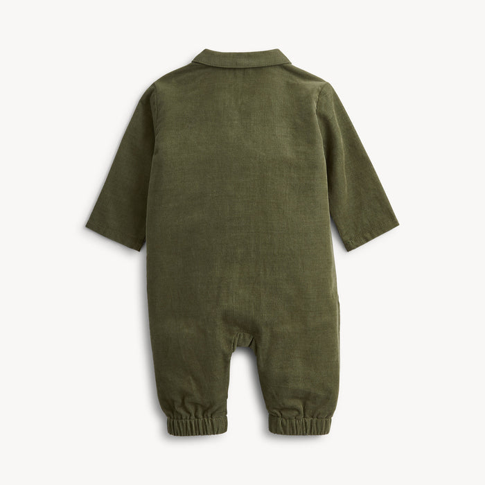 An olive green long-sleeve baby jumpsuit shown from the back, featuring a collar and elasticized leg cuffs, photographed against a clean off-white background.