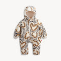 A sherpa fleece romper with a tiger-stripe pattern in black, brown, and beige on a white background.