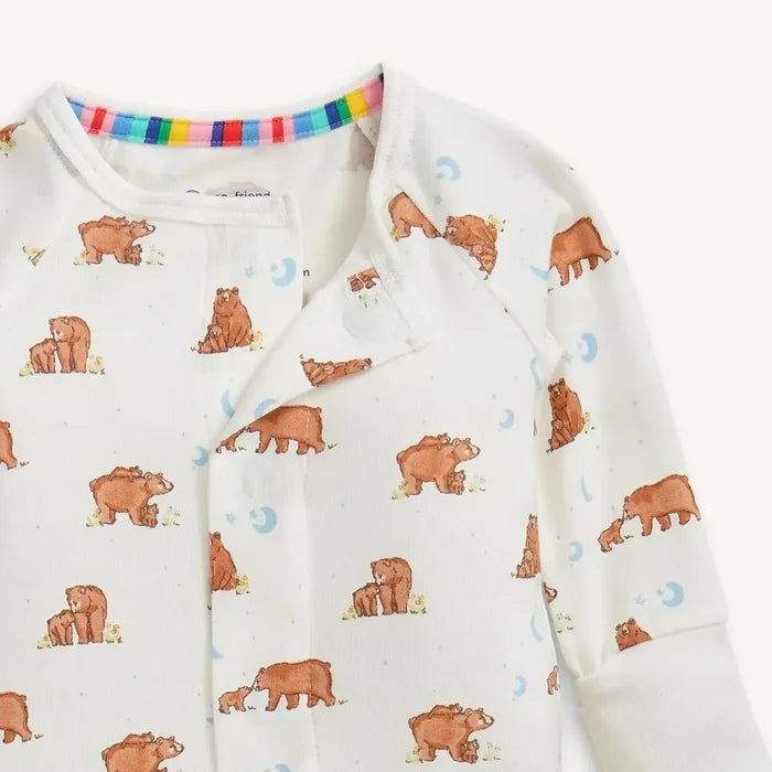 Baby onesie with bear pattern and rainbow trim on a white background
