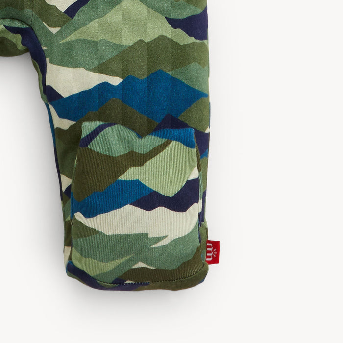 Camouflage-patterned romper leg with a visible brand logo on a white background