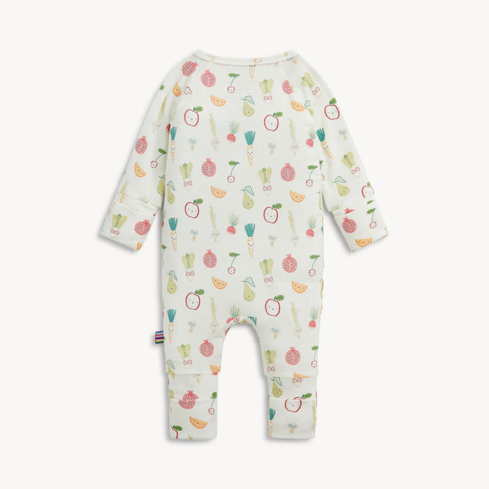 Back view of a baby romper with a colorful, all over print of cartoon fruits and vegetables