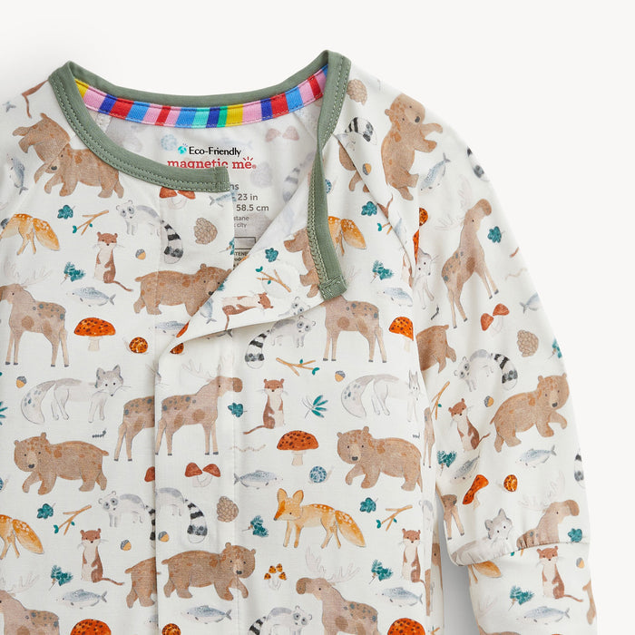 Close up of a children's onesie with animal pattern on a white background
