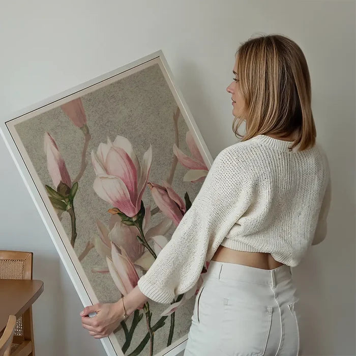 Magnolia by l Prang Flower Print held up against a living room wall