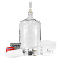Master Vintner Fresh Harvest 5-Gallon Upgrade, containing a winemakers handbook, 5-gallon glass carboy, straining bag, and various chemicals for cleaning and stabilizing