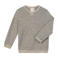A long-sleeve crewneck sweater with thin horizontal black stripes on a warm beige background, featuring solid beige ribbed cuffs, hem, and collar, shown flat on a white background.
