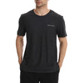 Man wearing a black t-shirt with a logo on a white background