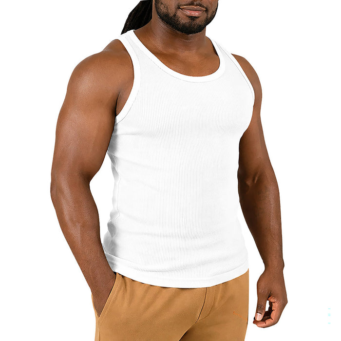 Man wearing a white tank top ands on a white background