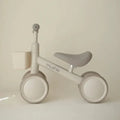Children's balance bike with 'mushie' branding on a plain background