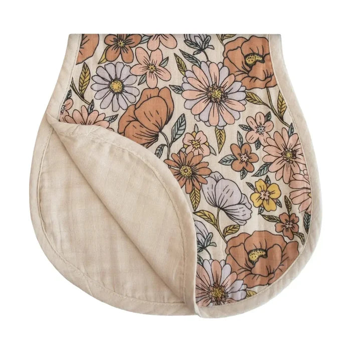 Floral-patterned burp cloth with beige interior on a white background