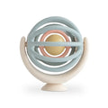 Colorful baby spinning ball pastel hues on a white background