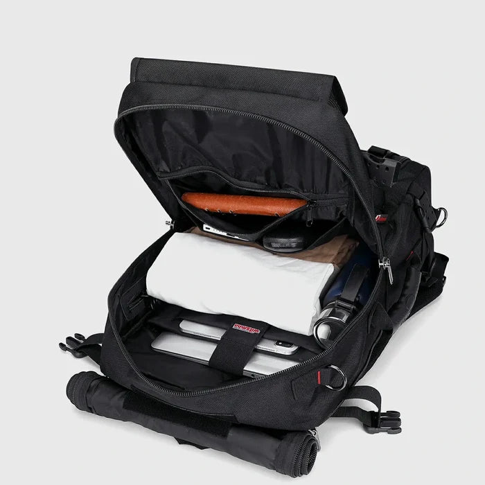 Black nylon carry on backpack with spacious main compartment open for organized packing