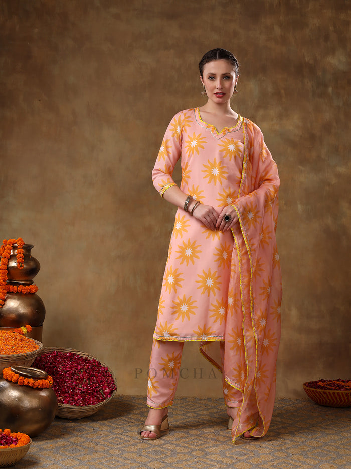 Peach Sunburst Printed Georgette Salwar Set With Yellow Accent Piping