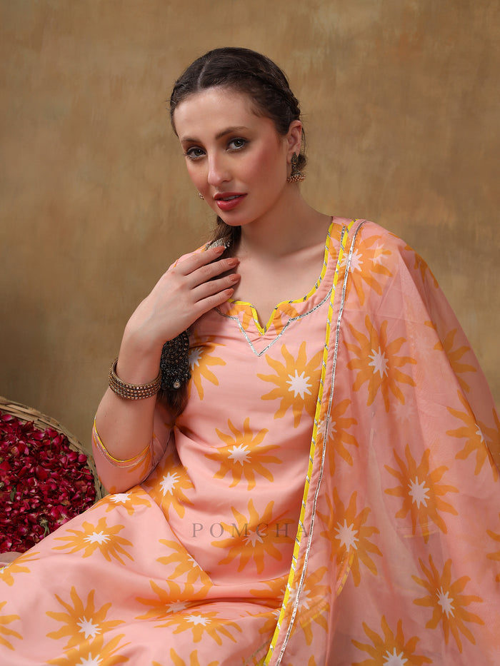 Peach Sunburst Printed Georgette Salwar Set With Yellow Accent Piping