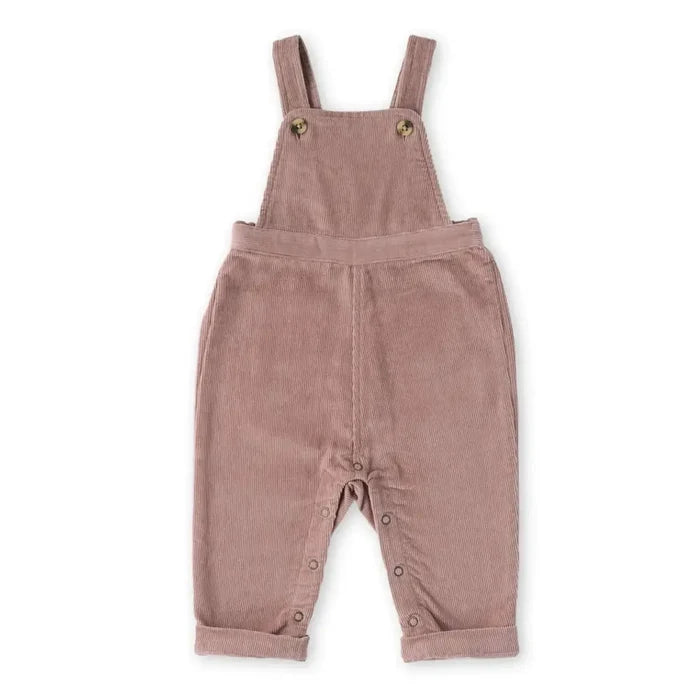 A baby's dusty rose corduroy overall romper with adjustable shoulder straps and snap-button leg cuffs, shown flat on a white background.
