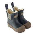 A pair of children's dark navy blue rubber rain boots with a soft beige fleece lining, elastic side gussets, and brown rubber soles, shown on a plain white background.