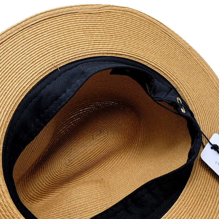 Close-up of a straw hat with a visible brand tag on a white background
