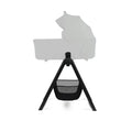 Black and gray bassinet stand with canopy on a white background
