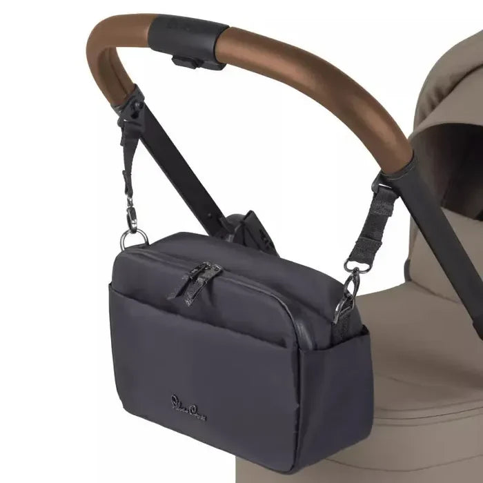 Gray stroller bag attached to a beige stroller on a white background