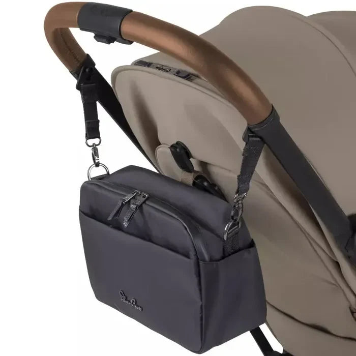 Gray stroller organizer attached to a beige stroller on a white background