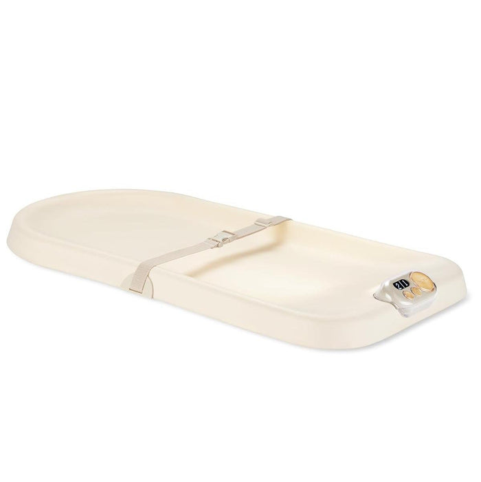 Beige baby changing pad on a white background
