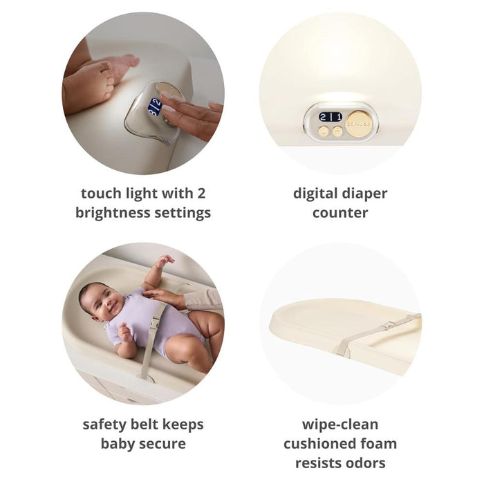 Baby changing pad with features highlighted including touch light, digital diaper counter, safety belt, and cushioned foam.