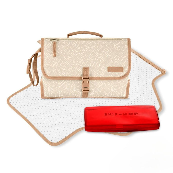 Beige diaper bag with a red organizer on a white background