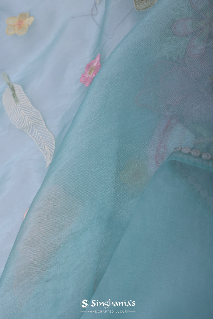 <img>  blue organza tissue saree with embroidery work