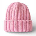 Pink knit beanie on a light gray background