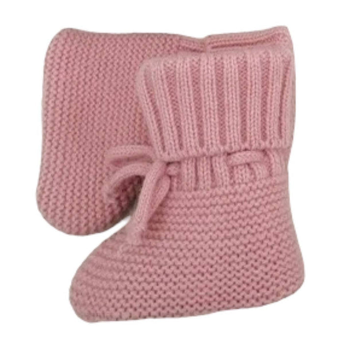 Pair of pink knitted baby booties on a white background