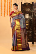 Steel Blue With Purple Contrast Border And Gold Zari Buttis On Kanjivaram Silk Saree
