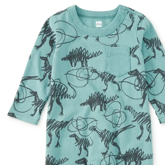 A baby long-sleeve romper in a light teal color, featuring an all-over black print of dinosaurs and scribbled lines, displayed flat against a white background.
