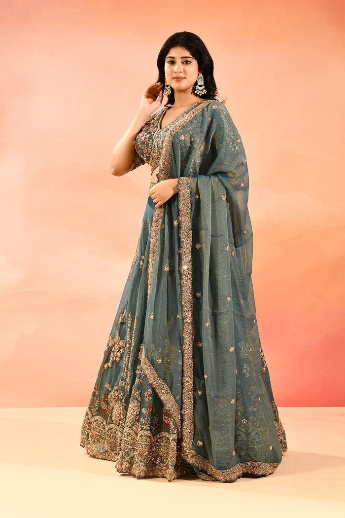 Teal Blue Animal And Floral Embroidered Tissue Lehenga