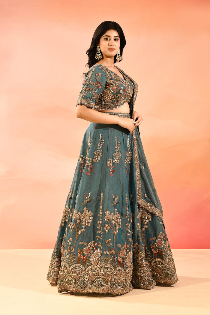Teal Blue Animal And Floral Embroidered Tissue Lehenga