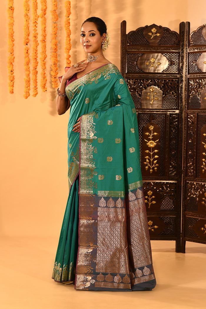 Teal Green With Gold Zari Butti And Bronze Woven Pallu Kanjivaram Silk Saree