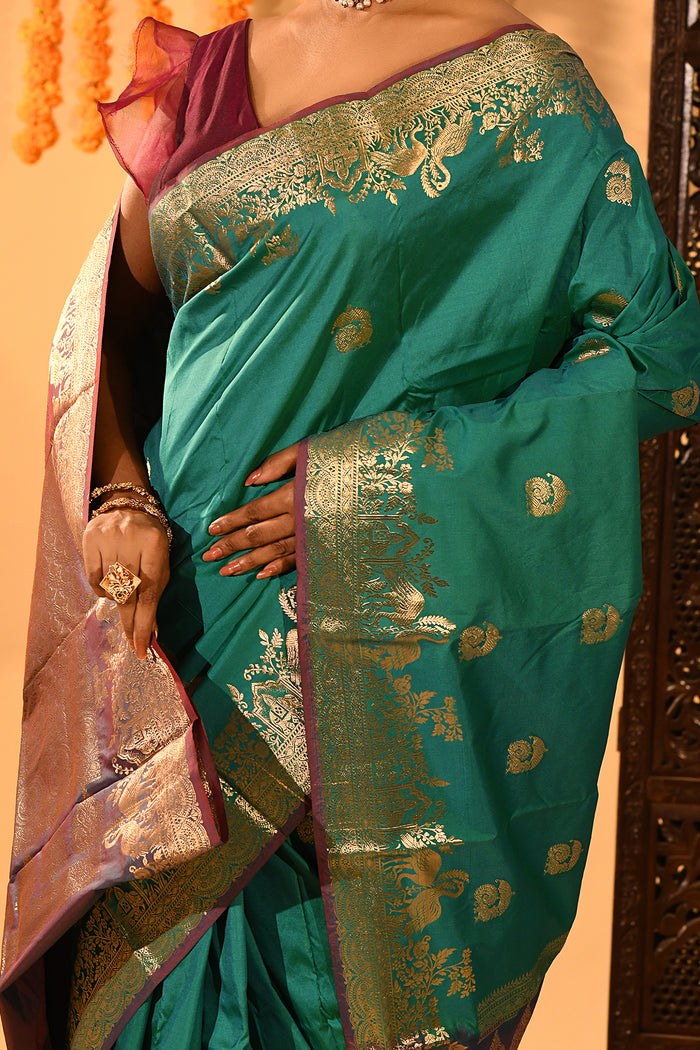 Teal Green With Gold Zari Butti And Bronze Woven Pallu Kanjivaram Silk Saree