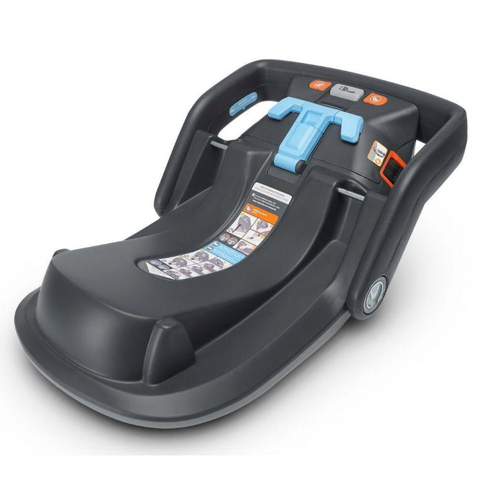A black UPPAbaby infant car seat extra base designed for Mesa + Mesa V2 models. The image shows the base with a red-to-green tightness indicator and blue seat belt routing.