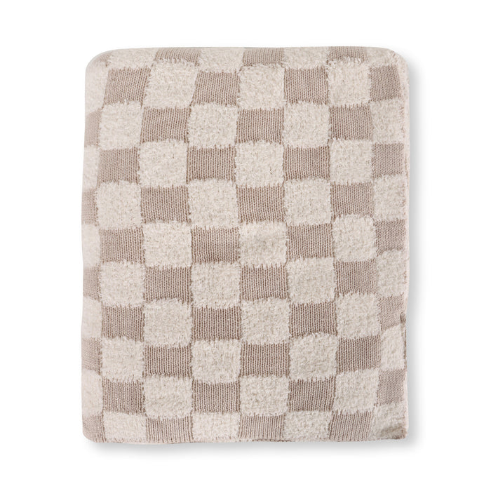 A folded textured throw blanket featuring a beige and off-white checkerboard pattern, shown against a plain white background.