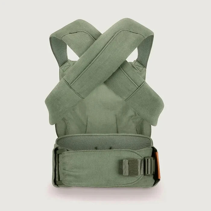 Green baby carrier on a light gray background