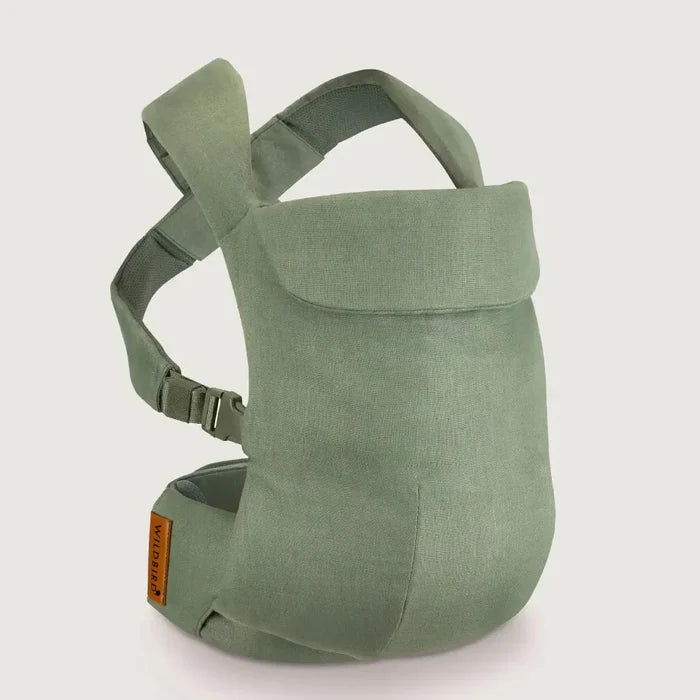 Green baby carrier on a light gray background