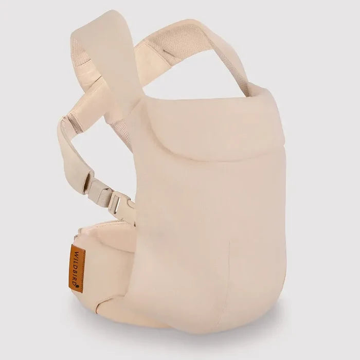Beige baby carrier on a light gray background