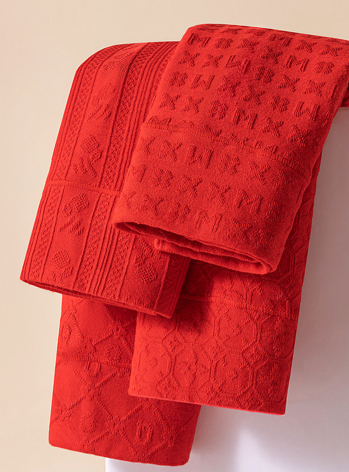 Close-up of women's high-waisted cotton underwear in four patterns: Vertical Stripe, Windmill, Letter Q and Monogram
